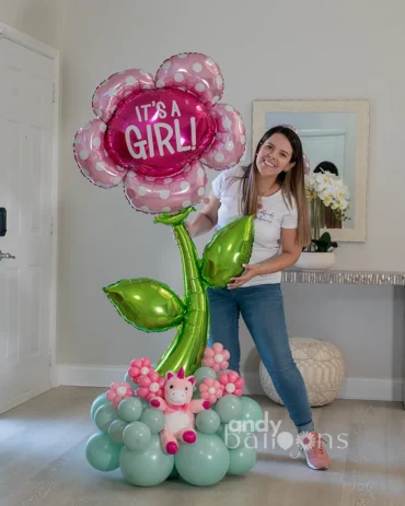 Baby girl welcome gift featuring a 5ft flower balloon and a unicorn plush, perfect for celebrating a new arrival