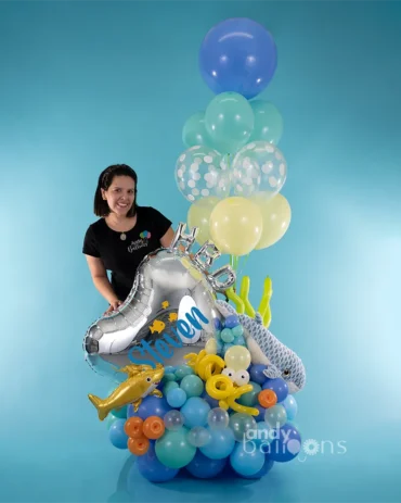 Ocean-themed balloon arrangement with ocean animal balloons and a plush toy, perfect for an ocean party or themed celebration