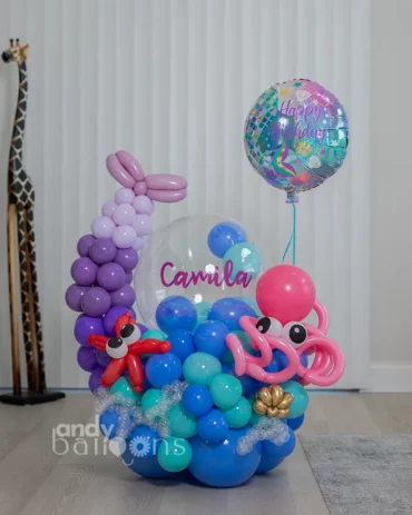 Mermaid-themed balloon bouquet with seashell balloons, pastel ocean colors, and birthday details