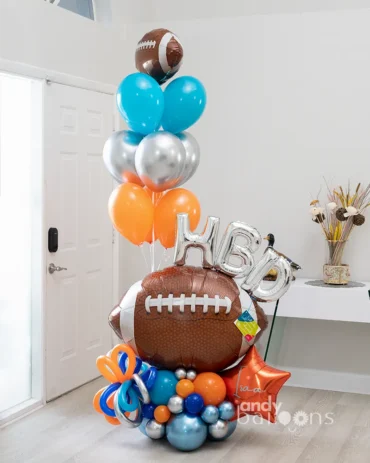Football-themed balloon bouquet for a birthday celebration, featuring a football balloon and custom birthday elements