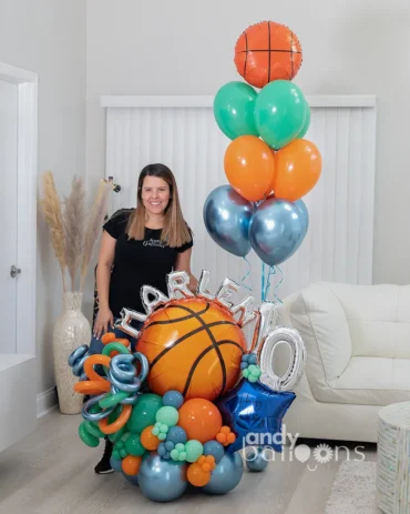 Basketball-themed balloon arrangement with personalized name and age, featuring a basketball-shaped balloon