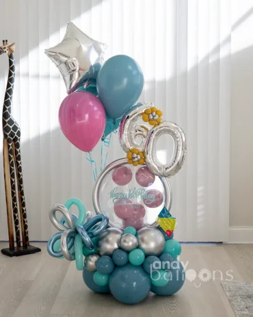 Luxury bubble balloon arrangement personalized with age and helium balloons, perfect for birthdays and special occasions