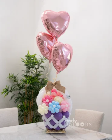 Balloon-crafted spring floral basket paired with Ferrero Rocher chocolates, a delightful gift for birthdays, spring celebrations, or just because
