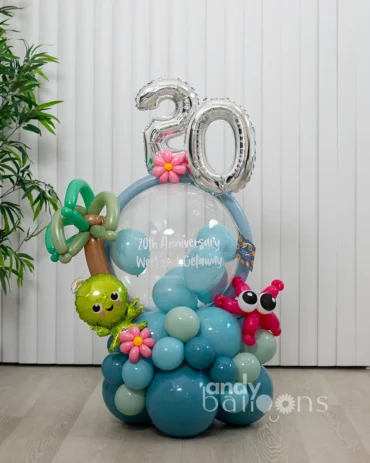 Beach-themed bubble balloon arrangement with tropical colors and summer party details, perfect for beach lovers and sunny celebrations