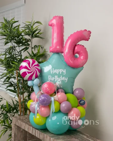 Colorful candy themed balloon bouquet with sweet-inspired decorations
