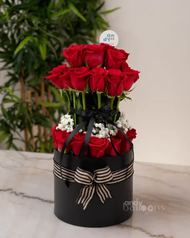Layered rose box with fresh red roses arranged in an elegant gift box